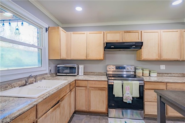 kitchen with light brown cabinetry, under cabinet range hood, stainless steel appliances, light countertops, and a sink