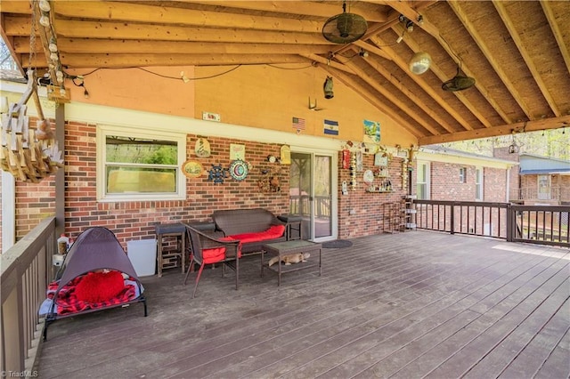 wooden terrace featuring outdoor lounge area