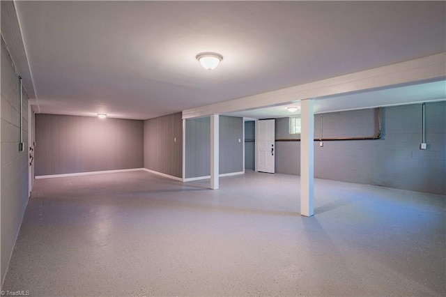 below grade area with concrete block wall
