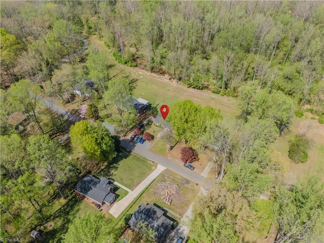 aerial view with a wooded view