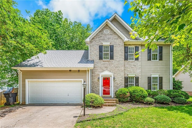 1515 Klompen Rd, Kernersville, NC 27284 - view of front of home with an attached garage, concrete driveway, and a front yard
