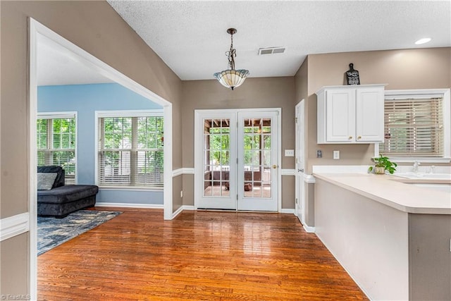 1515 Klompen Rd, Kernersville, NC 27284 - entryway featuring wood finished floors, french doors, baseboards, and a textured ceiling