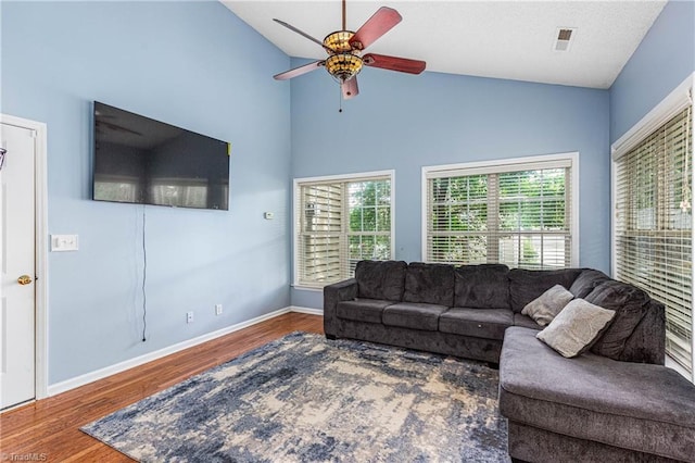 1515 Klompen Rd, Kernersville, NC 27284 - living area featuring a ceiling fan, plenty of natural light, wood finished floors, vaulted ceiling, and baseboards