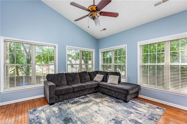 1515 Klompen Rd, Kernersville, NC 27284 - living area featuring baseboards, wood finished floors, ceiling fan, and high vaulted ceiling