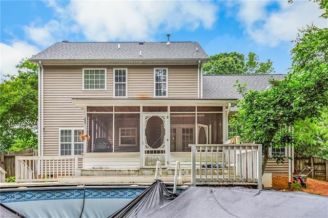 1515 Klompen Rd, Kernersville, NC 27284 - rear view of house with a sunroom, a covered pool, and roof with shingles