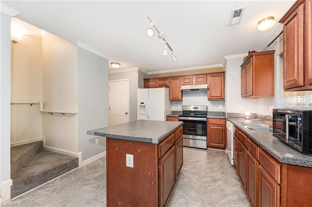 228 Timberwood Dr, High Point, NC 27260 - kitchen with white appliances, dark countertops, light marble finish floors, a kitchen island, and brown cabinets