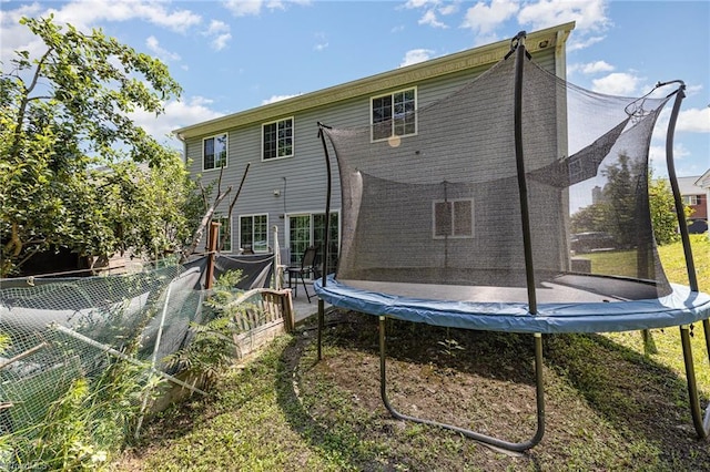228 Timberwood Dr, High Point, NC 27260 - rear view of house with a trampoline