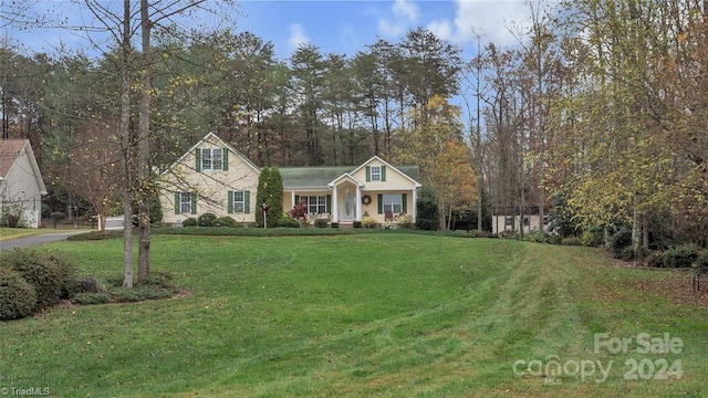 view of front of home featuring a porch and a front lawn