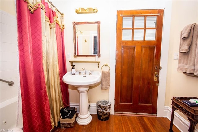 bathroom with sink and wood-type flooring