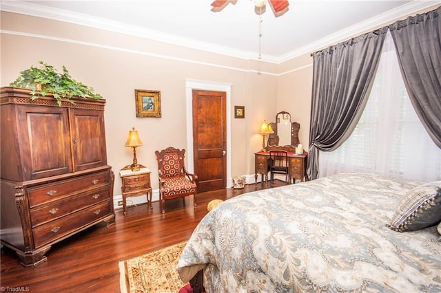 bedroom with dark hardwood / wood-style flooring, crown molding, and ceiling fan