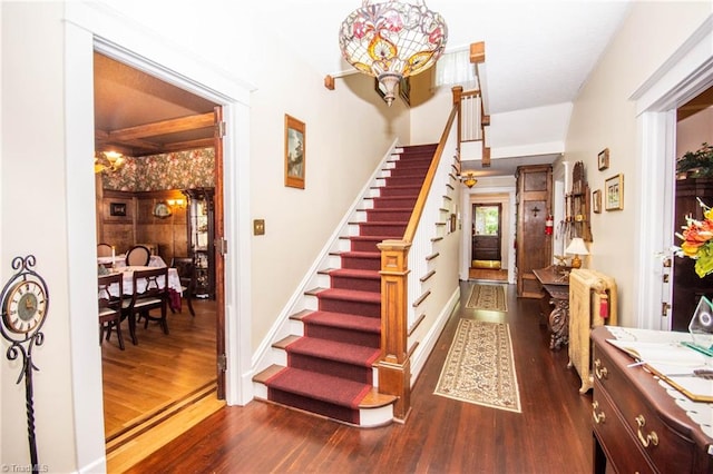 stairs featuring dark hardwood / wood-style flooring