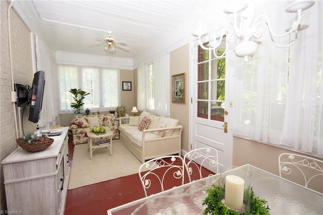 dining area with brick wall and ceiling fan with notable chandelier