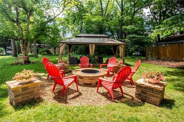 view of yard with an outdoor fire pit and a gazebo