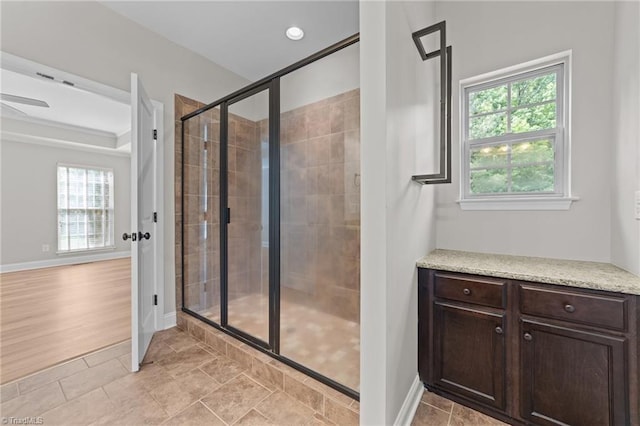 full bathroom with a shower stall, baseboards, and tile patterned flooring