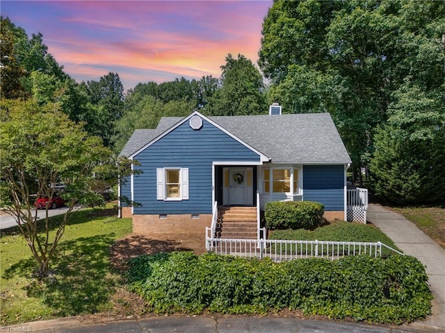 944 Chatfield Dr, Jamestown, NC 27282 - bungalow-style house featuring a shingled roof, a chimney, crawl space, covered porch, and a lawn