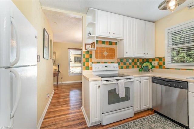 944 Chatfield Dr, Jamestown, NC 27282 - kitchen featuring white appliances, tasteful backsplash, white cabinets, and wood finished floors