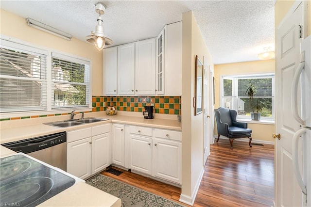 944 Chatfield Dr, Jamestown, NC 27282 - kitchen featuring dishwasher, freestanding refrigerator, wood finished floors, a textured ceiling, and white cabinets