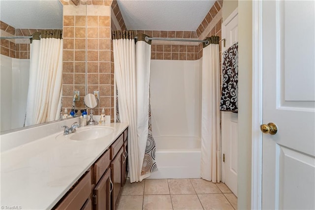 944 Chatfield Dr, Jamestown, NC 27282 - full bath featuring a textured ceiling, vanity, shower / bathtub combination with curtain, and tile patterned floors