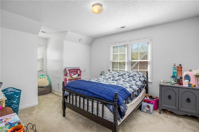 4104 Moss Brook Dr, Winston-Salem, NC 27127 - bedroom with a textured ceiling, multiple windows, light colored carpet, and visible vents