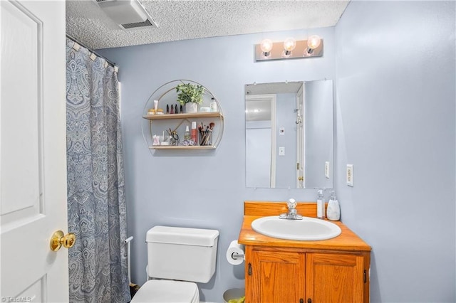 4104 Moss Brook Dr, Winston-Salem, NC 27127 - full bath with a textured ceiling, visible vents, a shower with shower curtain, toilet, and vanity