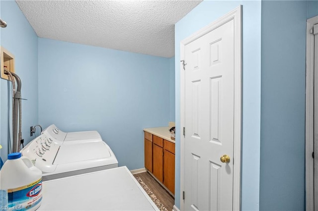 4104 Moss Brook Dr, Winston-Salem, NC 27127 - laundry room with a textured ceiling, wood finished floors, laundry area, and separate washer and dryer