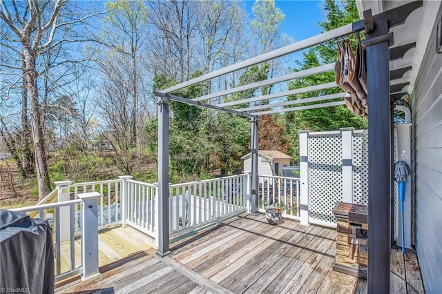 4104 Moss Brook Dr, Winston-Salem, NC 27127 - wooden terrace featuring a storage unit, an outdoor structure, grilling area, and a pergola