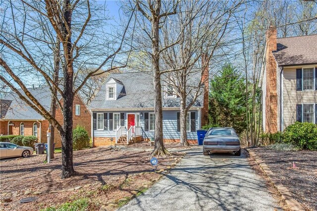 4104 Moss Brook Dr, Winston-Salem, NC 27127 - new england style home featuring driveway
