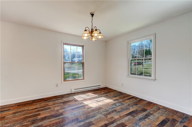 spare room with a baseboard radiator, baseboards, dark wood-style floors, and a chandelier