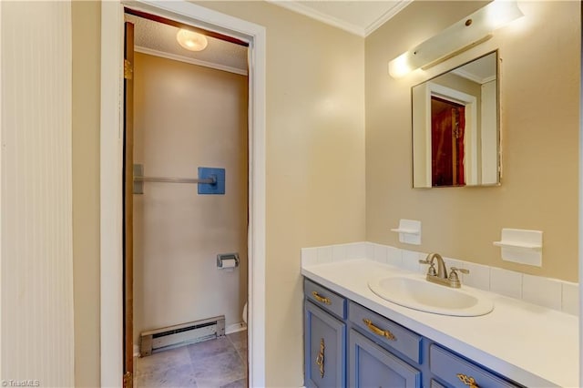 bathroom featuring baseboard heating, toilet, vanity, and ornamental molding