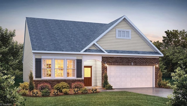 view of front of home featuring a garage and a lawn