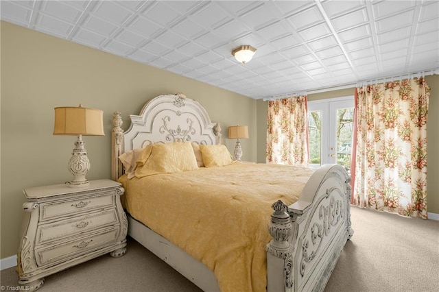 bedroom with light carpet, access to outside, baseboards, and french doors