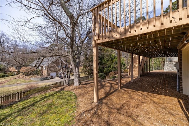 view of yard with fence and a wooden deck