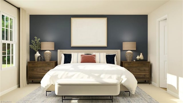 bedroom featuring light colored carpet, baseboards, and multiple windows