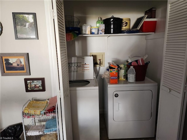 laundry room with washing machine and clothes dryer