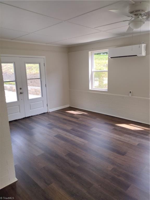 251 Marshall Farm Rd, Mount Airy, NC 27030 - empty room featuring a wall unit AC, dark wood finished floors, crown molding, french doors, and ceiling fan