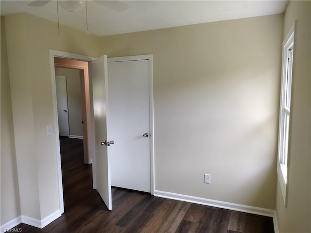 251 Marshall Farm Rd, Mount Airy, NC 27030 - unfurnished bedroom with dark wood-style floors and baseboards
