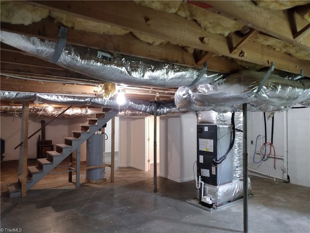 251 Marshall Farm Rd, Mount Airy, NC 27030 - unfinished below grade area featuring gas water heater, heating unit, and stairway
