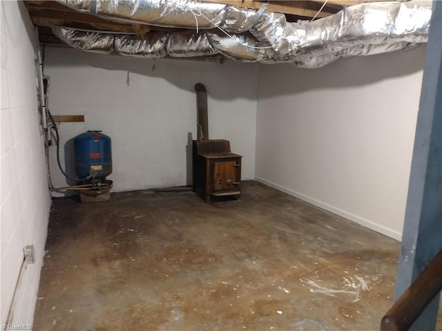 251 Marshall Farm Rd, Mount Airy, NC 27030 - below grade area with a wood stove, a water pressure tank, and concrete block wall