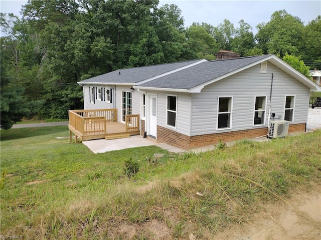 251 Marshall Farm Rd, Mount Airy, NC 27030 - back of house with a shingled roof, a wooden deck, a yard, brick siding, and a chimney