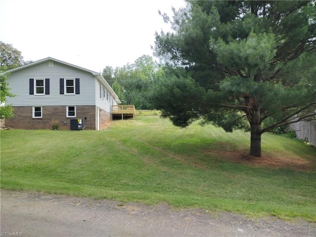 251 Marshall Farm Rd, Mount Airy, NC 27030 - view of side of property featuring a lawn, a wooden deck, and brick siding