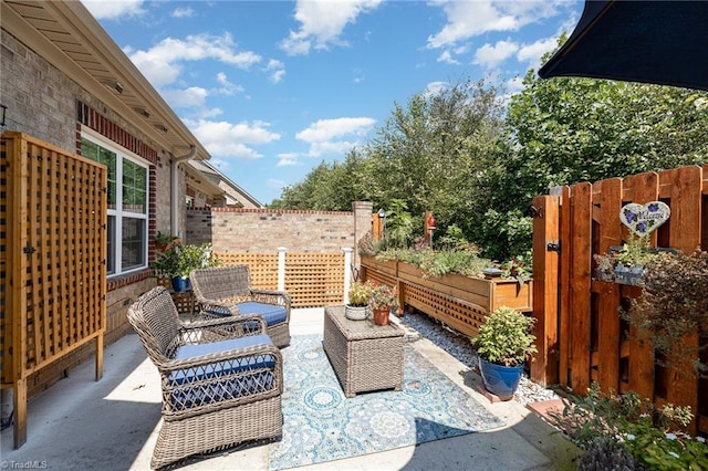 view of patio with fence and an outdoor living space