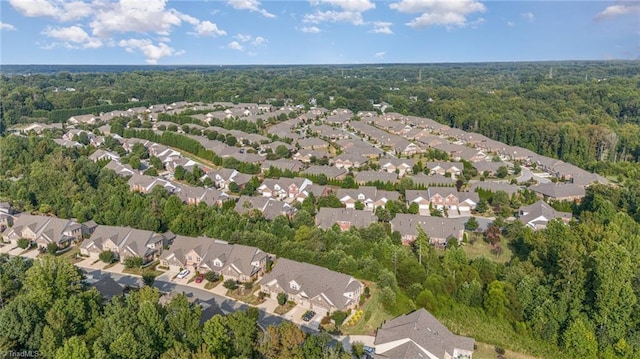 bird's eye view featuring a residential view and a view of trees