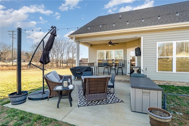 view of patio with an outdoor living space and a ceiling fan
