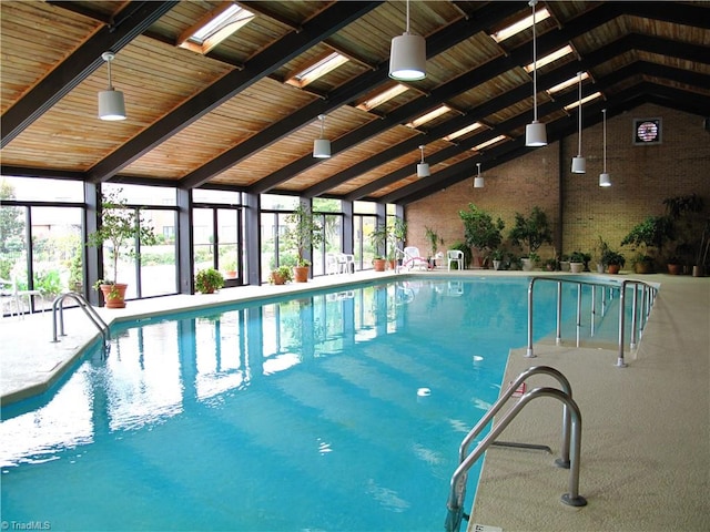 view of swimming pool with a skylight