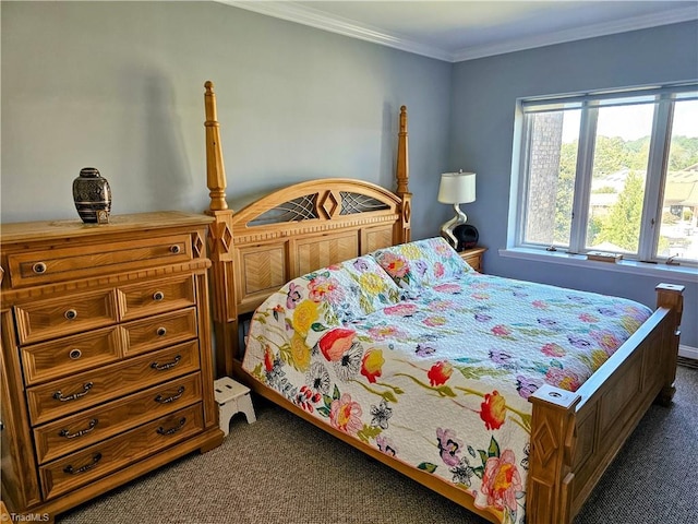 bedroom with crown molding and dark carpet