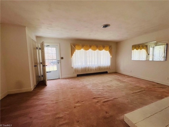 unfurnished room with a baseboard radiator and carpet flooring