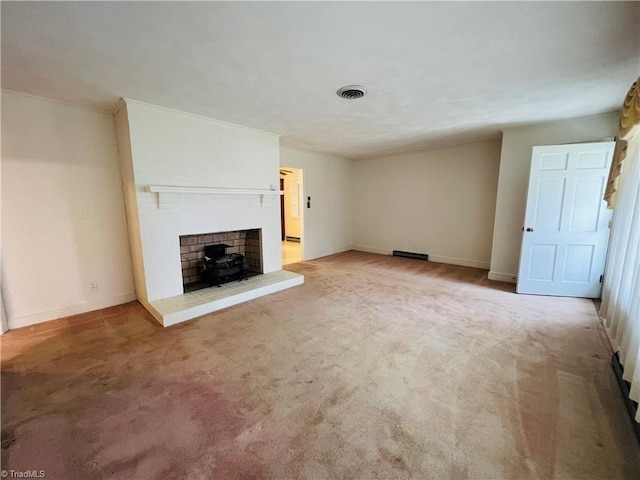 unfurnished living room featuring light carpet