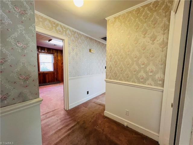 corridor featuring crown molding and carpet