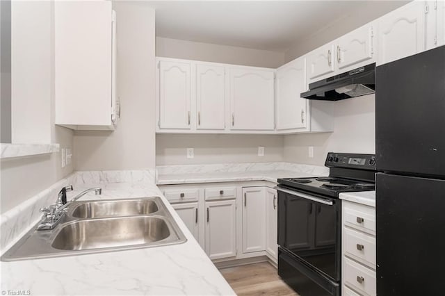 kitchen featuring sink, white cabinetry, black appliances, and light hardwood / wood-style flooring