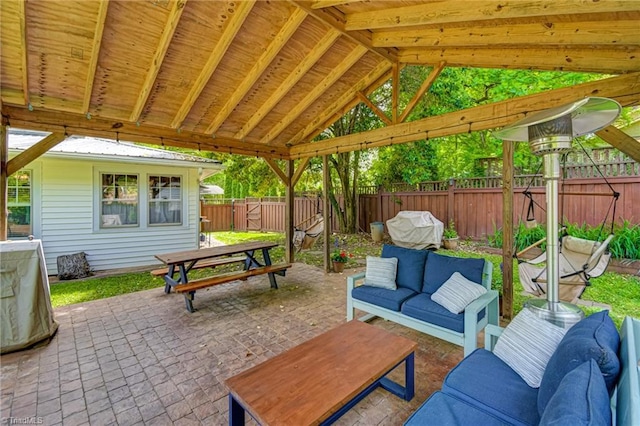 view of patio featuring outdoor lounge area, outdoor dining space, and a fenced backyard